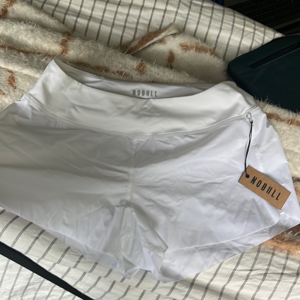 Unworn white NOBULL M running shorts w/ underwear lining